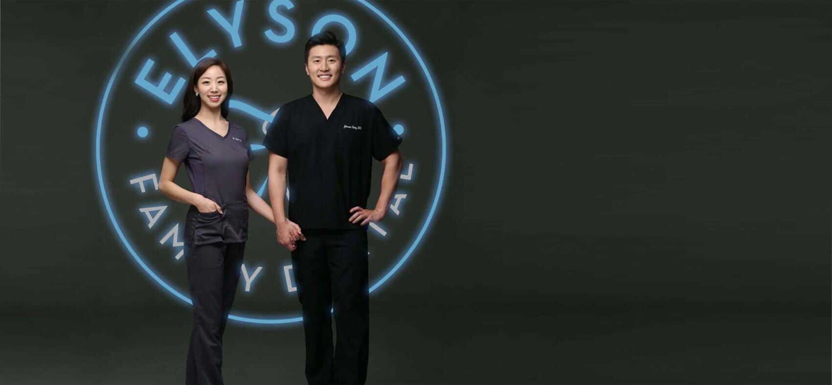 Dr. Yoo & Dr. Ching in front of logo