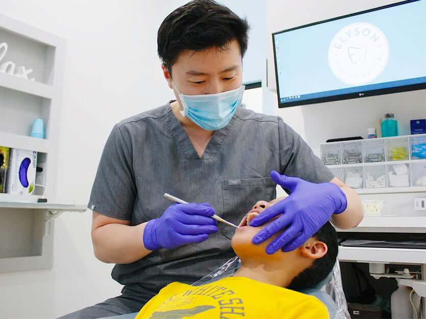 Dr. Cheng performing a dental exam